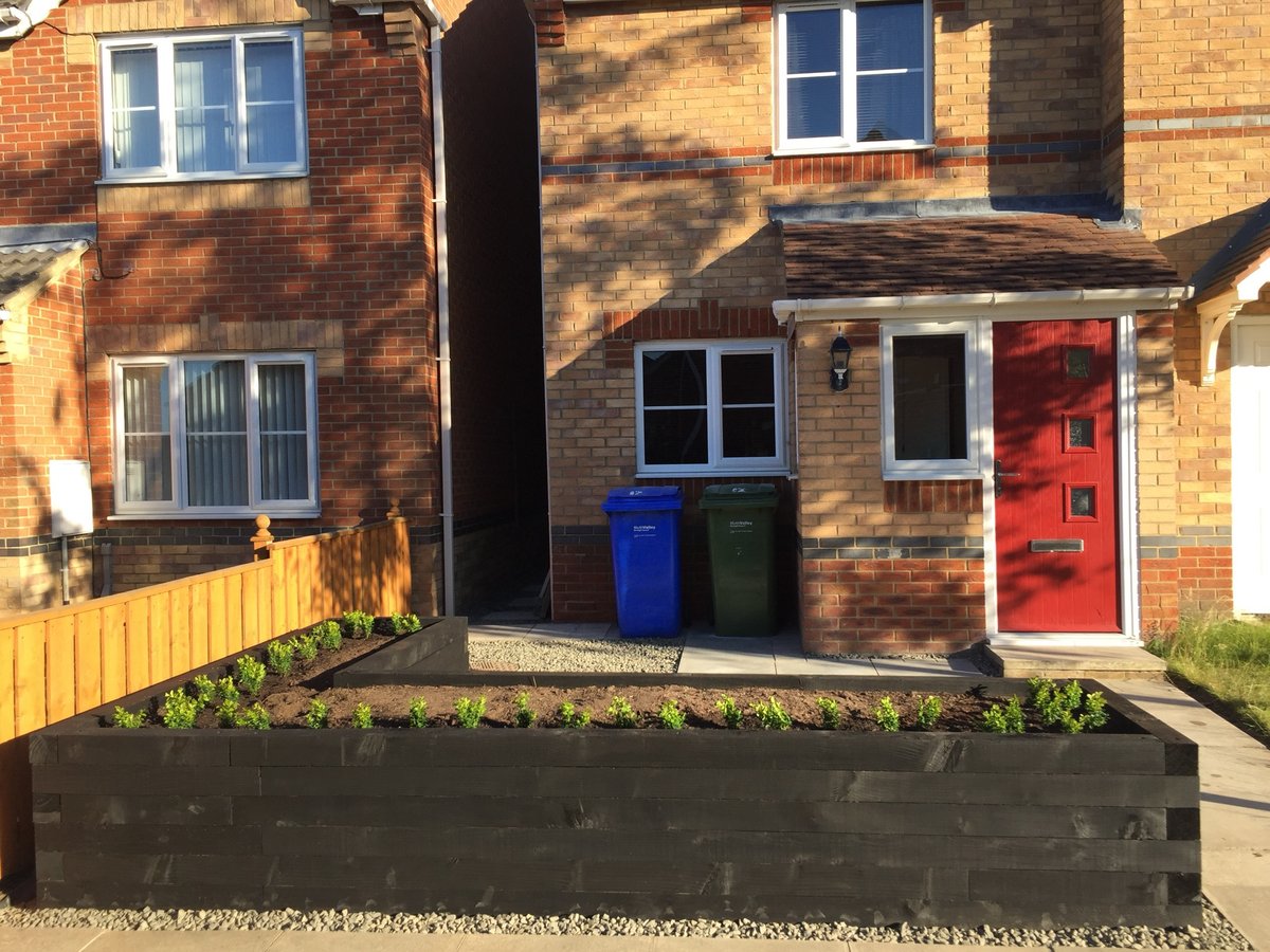 A raised bed feature to hide the fence